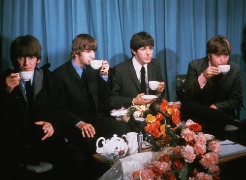 The Beatles enjoying some tea